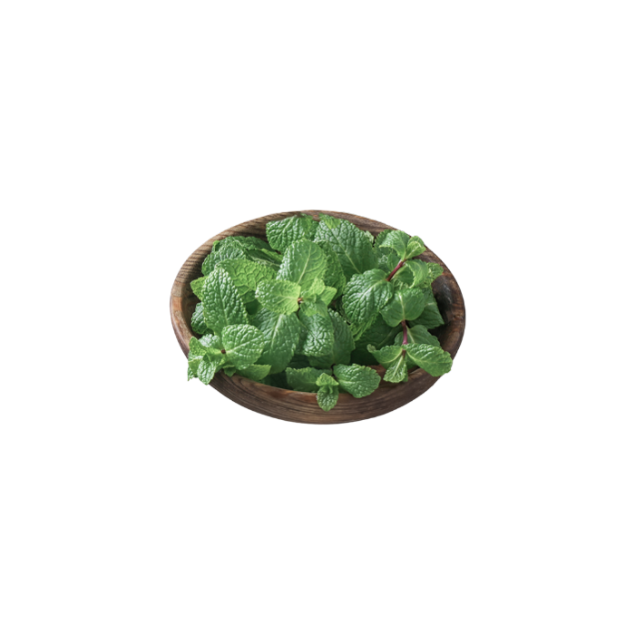 loose lemon balm leaves in a small wooden bowl