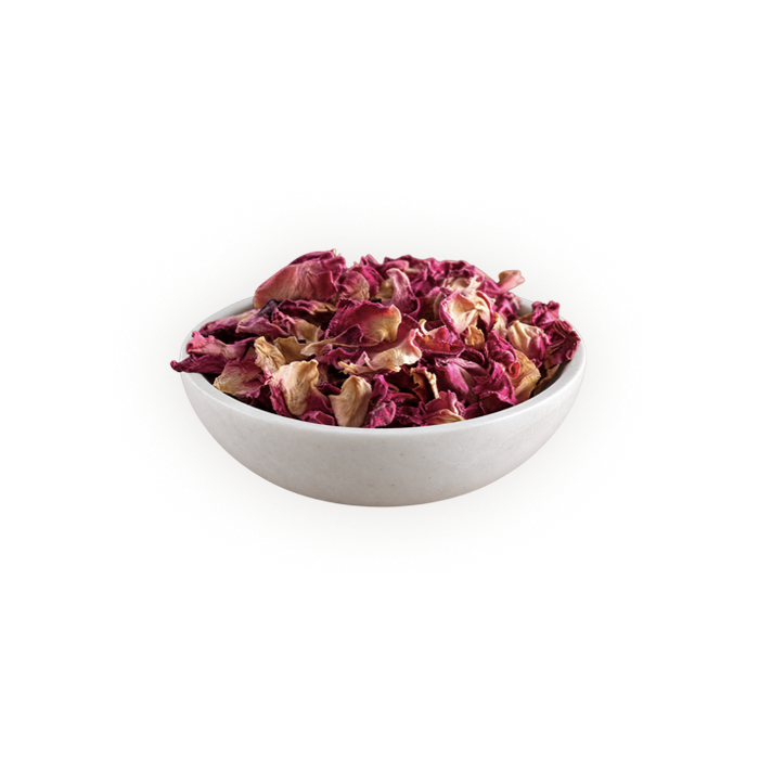 dried pink rose petals in a white bowl